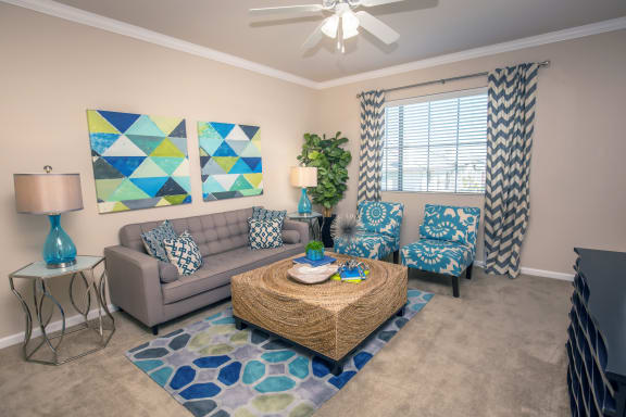 a living room with couches and a coffee table at Loreto & Palacio Apartments, Nevada 89149