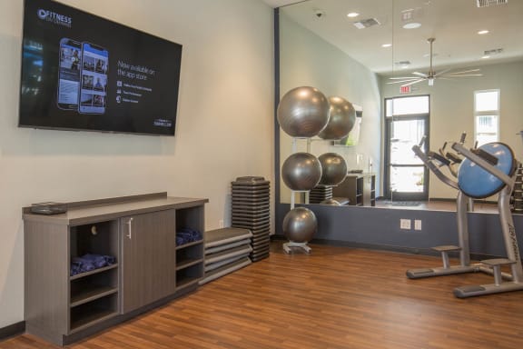 Gym with equipment and entertainmentat Level 25 at Oquendo by Picerne, Las Vegas, 89148
