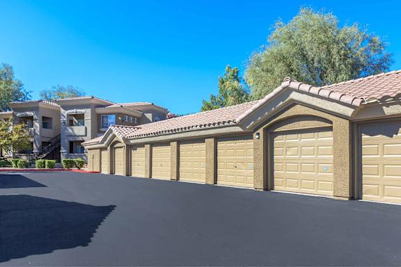a row of garage doors in front of a house at The Belmont by Picerne, Las Vegas, NV