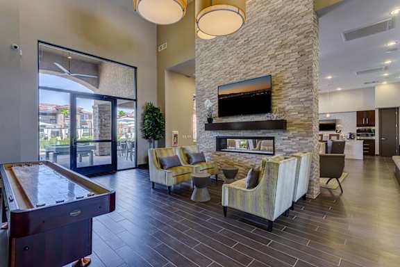 a clubhouse with a pool table and a stone fireplace t The View at Horizon Ridge, Nevada, 89012