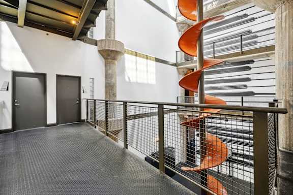 Interior hallway with historic chute from Ford factory | Adam Hats Lofts from Deep Ellum Lofts in Dallas, TX