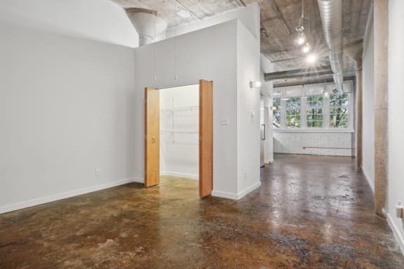 an empty room with a door in the middle of it