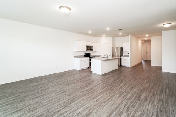 a spacious kitchen and living room area