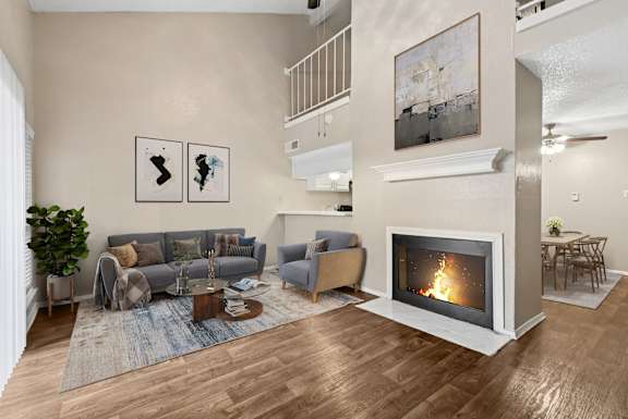 Virtually staged b2 living room at Noel on the Parkway in Dallas, TX