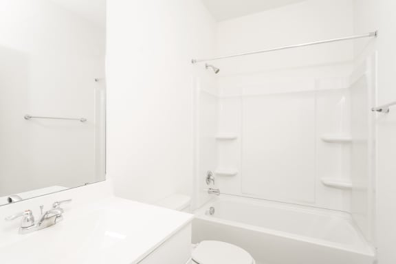 a bathroom with a bathtub and a sink