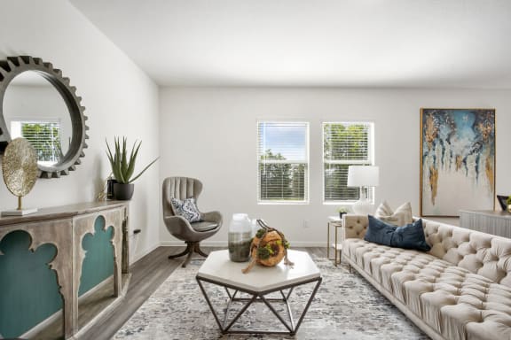 a living room with white walls and a white couch