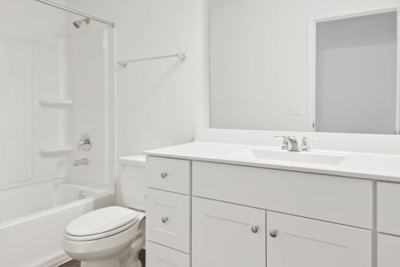 a bathroom with a sink toilet and bathtub