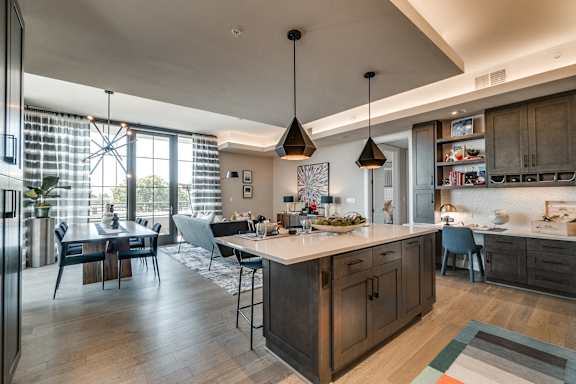 Fitted Kitchen With Island Dining at The Hamilton, Dallas, Texas