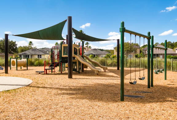 Large playground with swings and slides in Wynnfield Lakes apartments in Jacksonville, FL