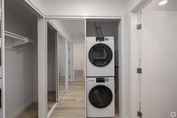 a small laundry room with a washing machine and a dryer