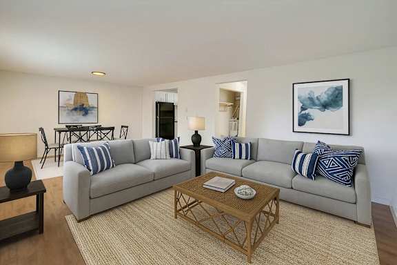 A living room with a grey couch and a coffee table.
