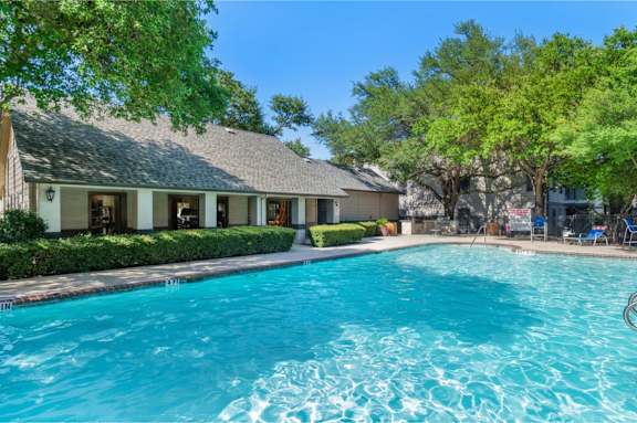 Resort style pool with clubhouse and lounge seating at Radius at the Domain Apartments, Austin