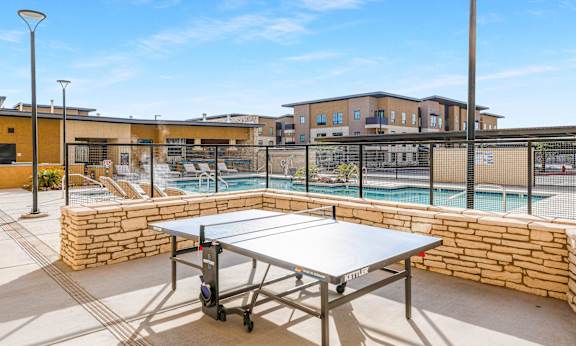 Ping pong table near the swimming pool at Solace at Ballpark Village, Goodyear, AZ, 85338