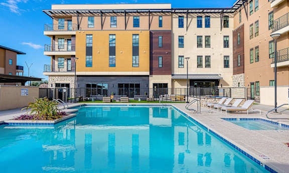 Relaxing Swimming Pool With Sundeck at Solace at Ballpark Village, Goodyear, AZ