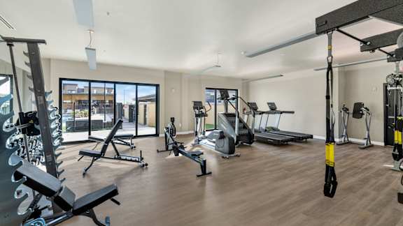 Fitness center with cardio equipment at Solace at Ballpark Village, Goodyear, Arizona