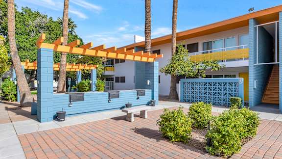 A modern building with a blue and orange color scheme at The Phoenix Apartments on 6th Avenue, Phoenix, Arizona
