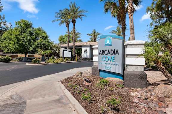 Arcadia Cove Apartments is a residential complex with a sign in front.