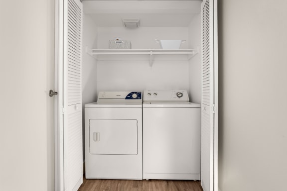 a small laundry room with a washer and dryer at Denim Scottsdale, Scottsdale, AZ