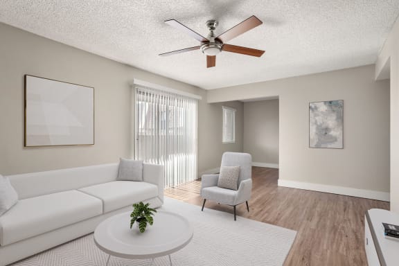 a living room with a ceiling fan and a couch at Denim Scottsdale, Scottsdale, 85251