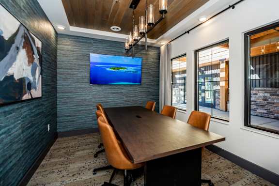 A conference room with a long table and chairs at The Crossings  at Windsong, Prescott Valley, 86314
