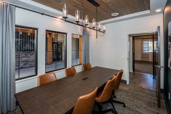 A conference room with a long table and chairs at The Crossings  at Windsong, Prescott Valley, 86314