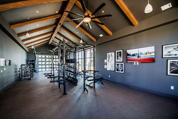 A room with a ceiling fan and pictures on the wall at The Crossings  at Windsong, Prescott Valley, 86314