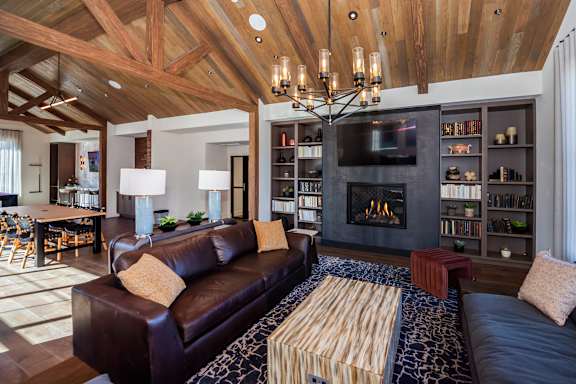 A living room with a fireplace and a couch  at The Crossings  at Windsong, Prescott Valley, 86314