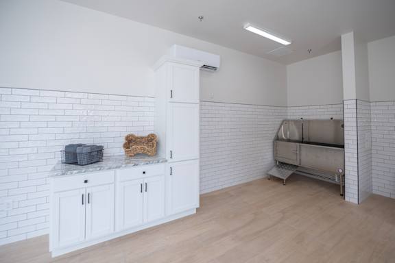 A white kitchen with a marble countertop and a dog bone on it at The Crossings  at Windsong, Prescott Valley, 86314