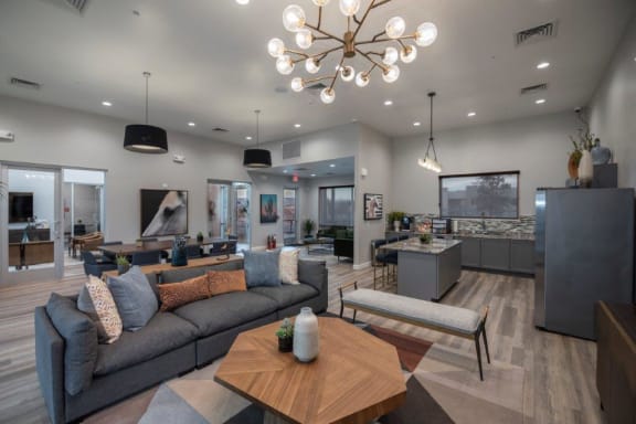 a living room with couches and a table and a chandelier at Inspiration Apartments, Arizona, 86326