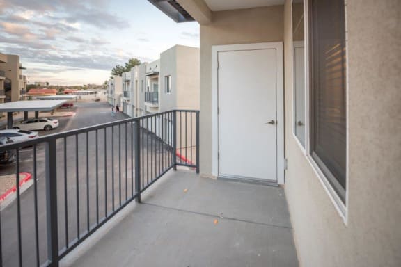 the door to the balcony of a building with a white door at Inspiration Apartments, Cottonwood, AZ, 86326