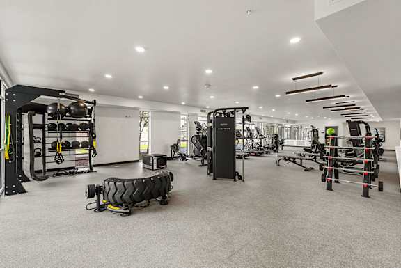 Fitness center with professional strength training equipment at Lucero Apartments, Phoenix, 85051