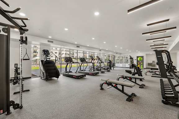 Fitness center with cardio and strength equipment at Lucero Apartments, Phoenix