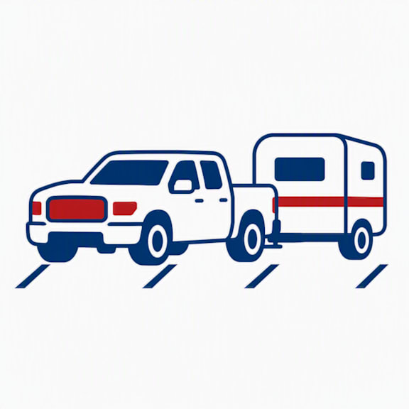 A white pickup truck towing a red and white trailer.