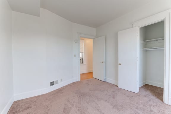 Beige Carpet In Bedroom at Johnson Legacy Apartments, Milwaukee, WI, 53223