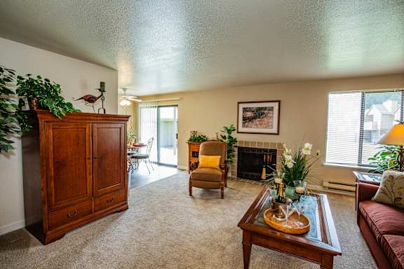Spacious Living Room with Fireplace at Apartment Complex in 98366