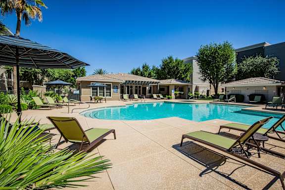 Luxurious Swimming Pool with Lounge Seating at Apartment Near Phoenix and the Arizona 101 Loop