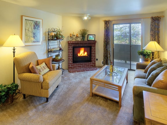 Spacious Model Apartment Living Room with Wood-Burning Fireplace in Renton Near Boeing