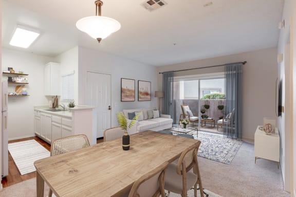a living room and dining room with a table and a couch