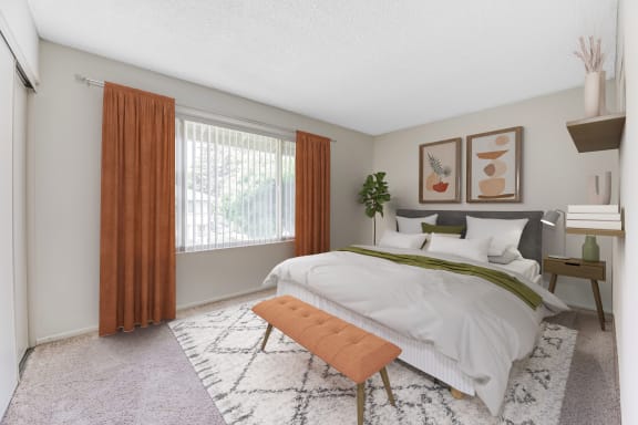 a bedroom with a large bed and a window with curtains
