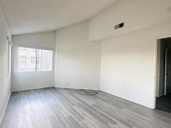 A room with a window and a door.