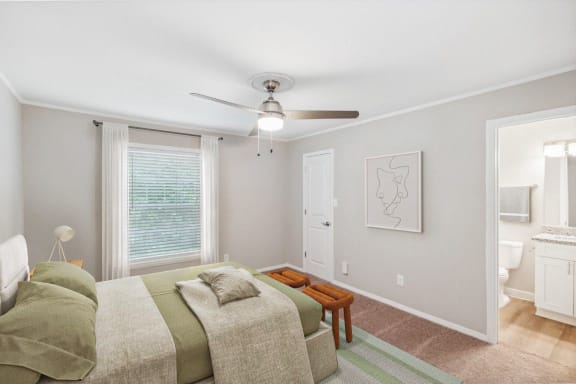 a living room with a couch and a ceiling fan at Lake Johnson Mews, Raleigh, 27606