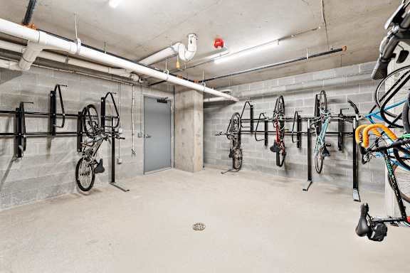 A bike parking area with bikes hanging on the wall at The Box, Richmond, VA, 23224