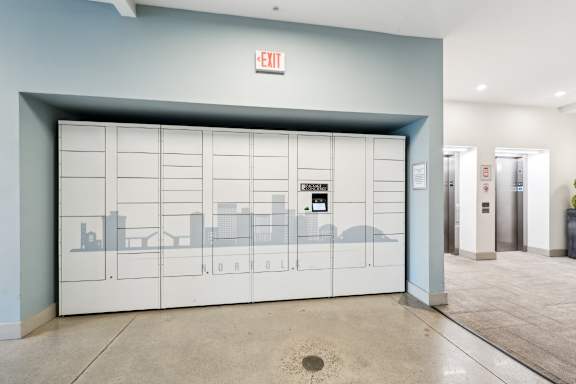 A white door with a red exit sign above it.