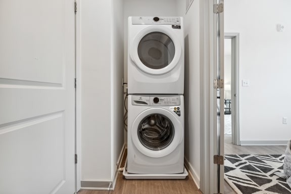 a front load washer and dryer in a laundry room at The Constellation Apartments, PRG Real Estate, Hampton, Virginia