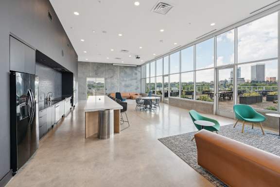 A modern kitchen with a view of the city. at South Falls Tower Apartments, Richmond, VA