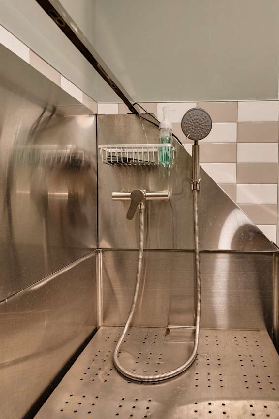 A shower head with a hose attached to it at The Carousel, Richmond, Virginia