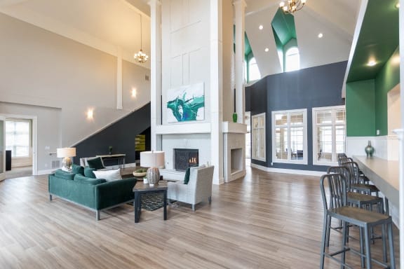 a living room with couches and chairs and a fireplace at The Resort At Lake Crossing Apartments, PRG Real Estate, Lexington, KY