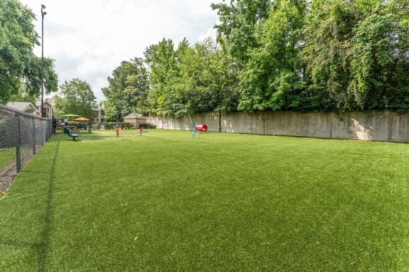 a large grass field with people playing on it at Willow Ridge Apartments, Charlotte, NC, 28210