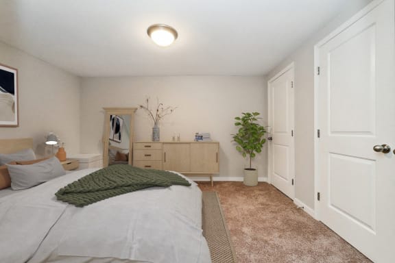 a bedroom with a bed and a closet at Hyde Park Townhomes, PRG Real Estate Management, Chester, VA