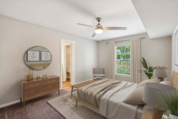 a bedroom with a bed and a ceiling fan at Lake Johnson Mews, Raleigh, NC